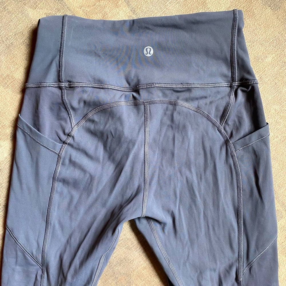 Lululemon leggings. Gray with side pockets. Size 4 cropped